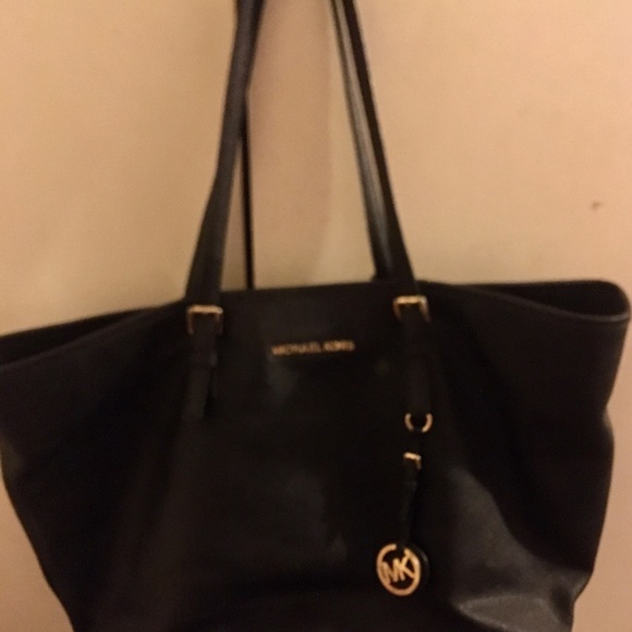 This Michael K bag is still in good use,wear on strips but no stains. - Picture 2 of 5
